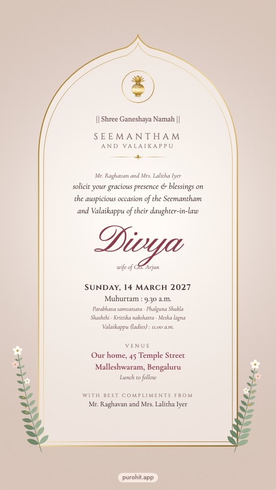 Seemantham invitation card on blush paper under a fine gold arch
